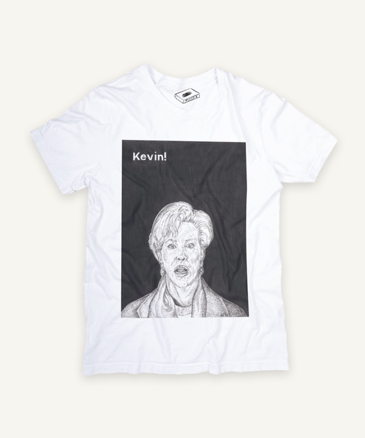 home alone T-shirt on ivory background with natural shadow