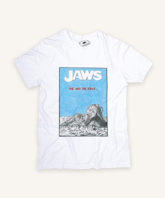 jaws T-shirt on ivory background with natural shadow
