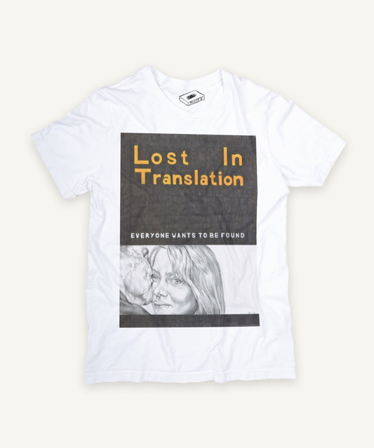 lost in translation T-shirt on ivory background with natural shadow