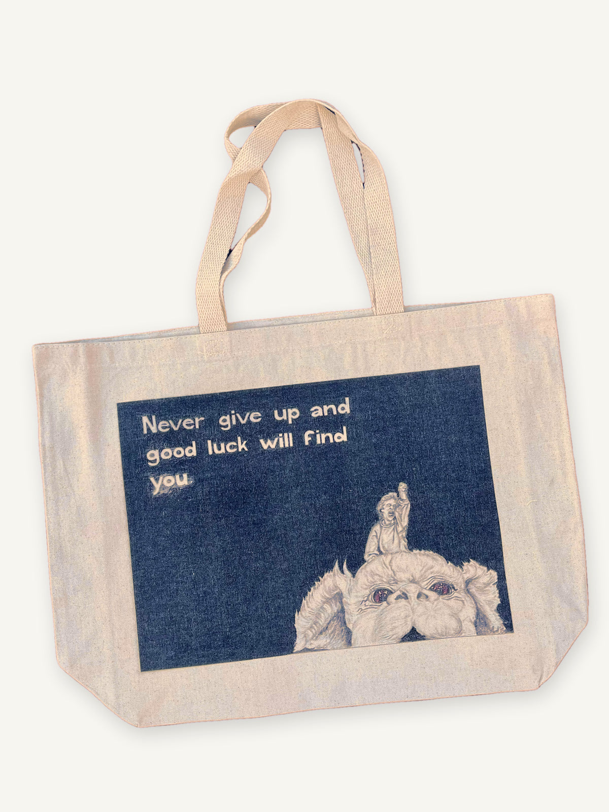The Never Ending Story TOTE with natural canvas color on an ivory background